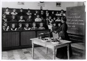 Young girls in a cookery lesson (b/w photo) 