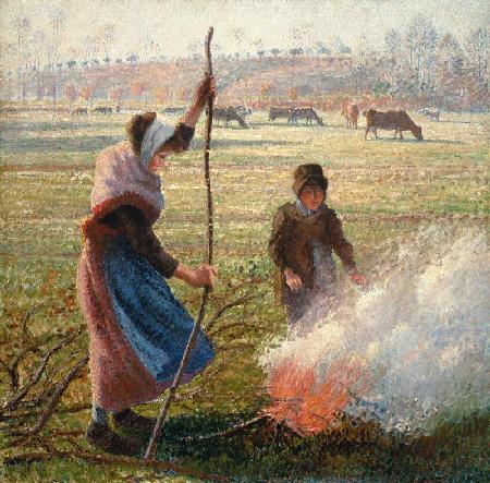 Femme de paysan en brûlant des branches