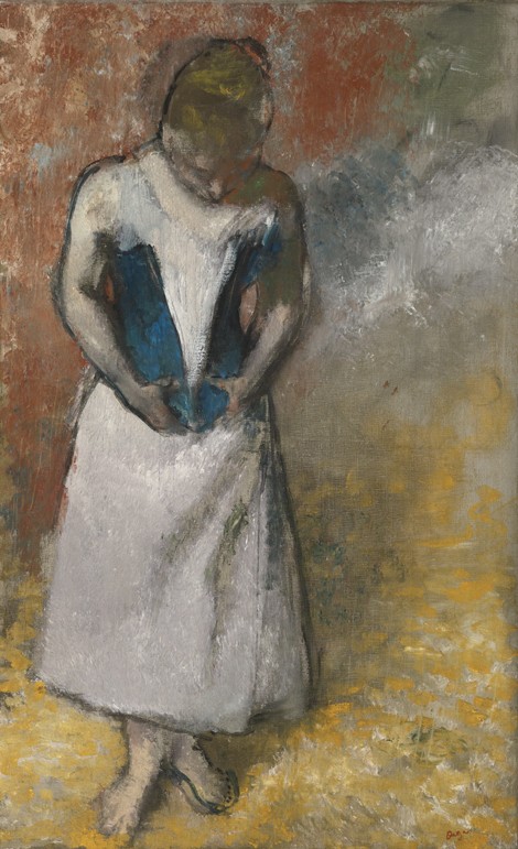 Woman standing from the front, clasping her corset à Edgar Degas