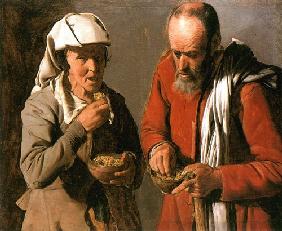Vieux couple de paysans mangeant