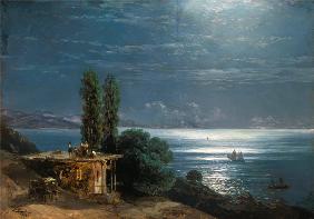 paysage nocturne à la mer avec la villa éclairée.
