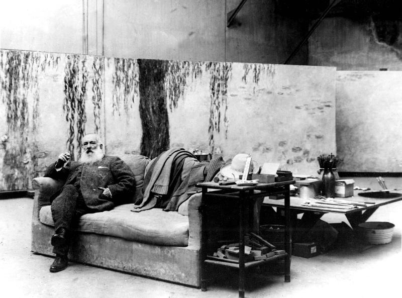 French painter Claude Monet in his workshop in front of one of his paintings Waterlilies à 
