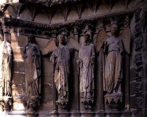 St. Nicaise flanked by two angels, sculptures on the exterior West Facade, 14th century originals (s à 