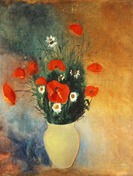 Vase avec des fleurs des coquelicots et des marguerites