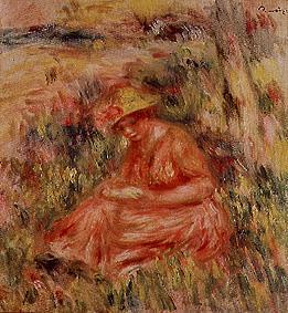 Jeune femme avec le chapeau dans un paysage rougeâtre.