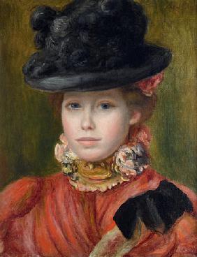 Jeune fille au chapeau noir à fleurs rouges