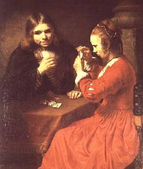 A Young Man and a Girl Playing Cards