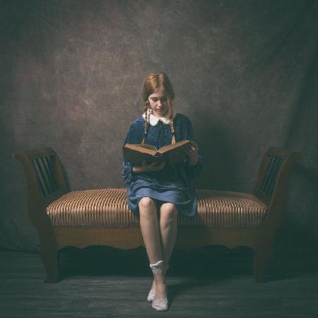 the reader in blue dress